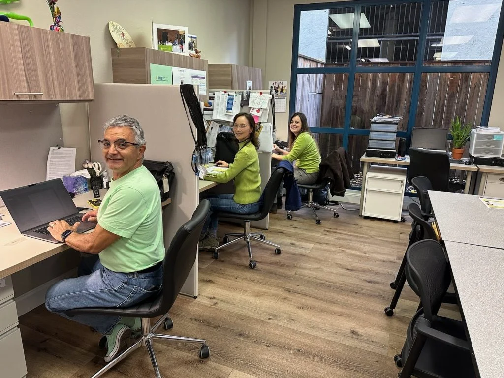 Three staff members sitting in NAMI CC's office